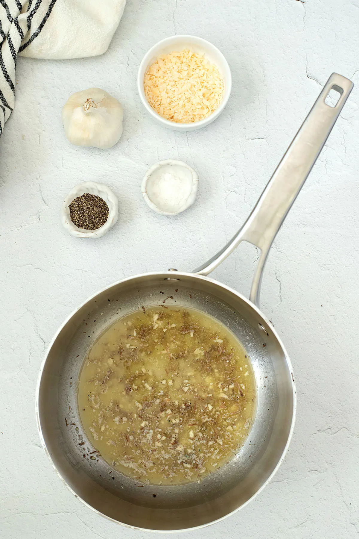 Truffles With Pasta 5 Silver saucepan with melted butter and garlic.