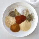 White plate full of spices to make blackening seasoning.