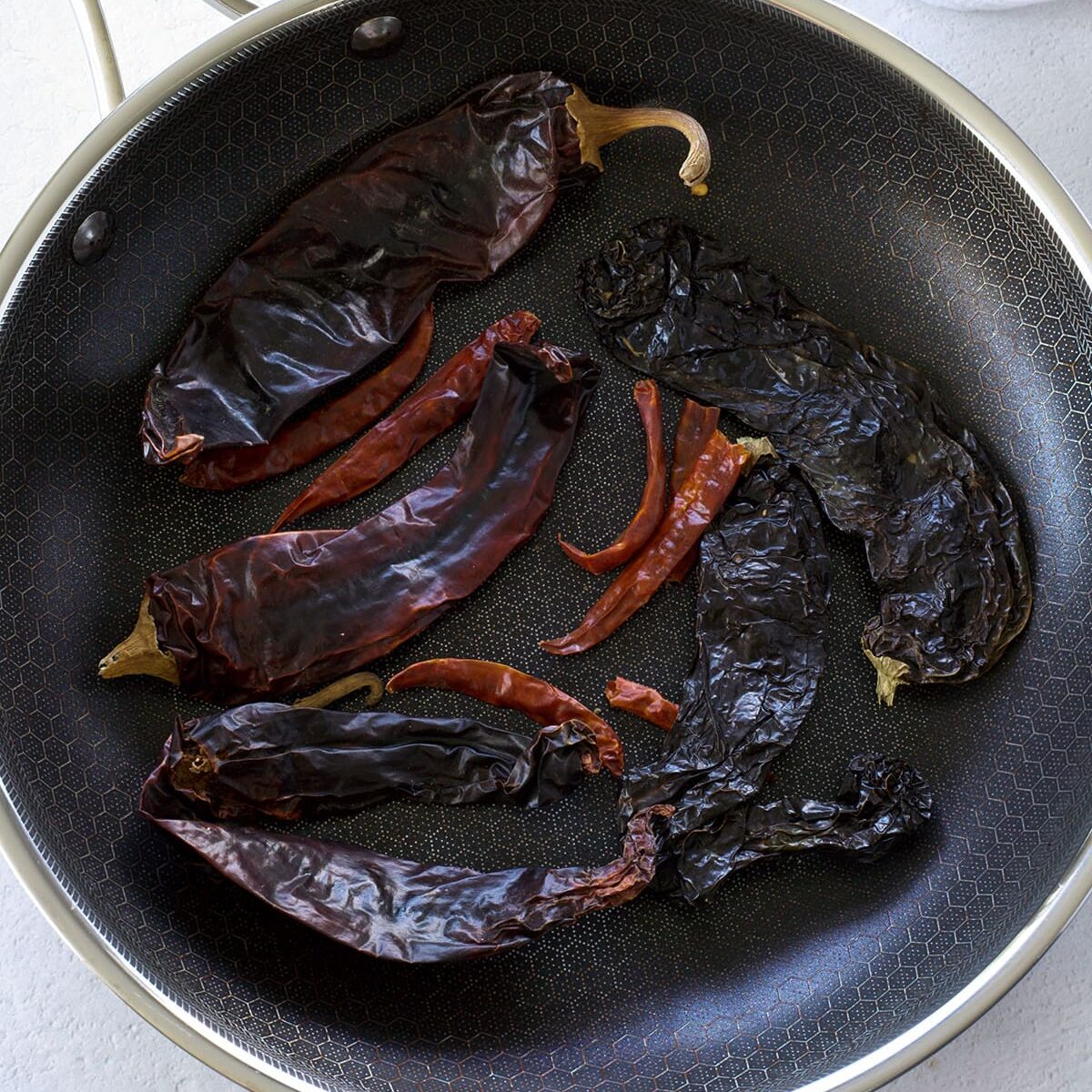 Skillet of a variety of dried chiles.