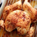 Roasted Oktoberfest Chicken on a roasting sheet.